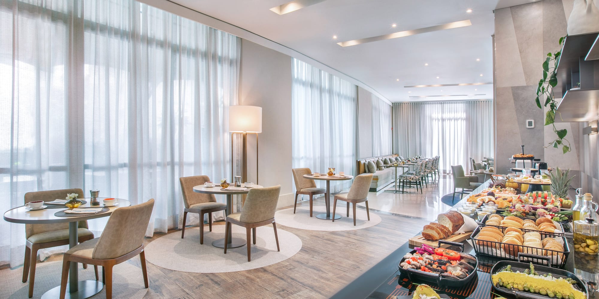 a room with a couch and chairs