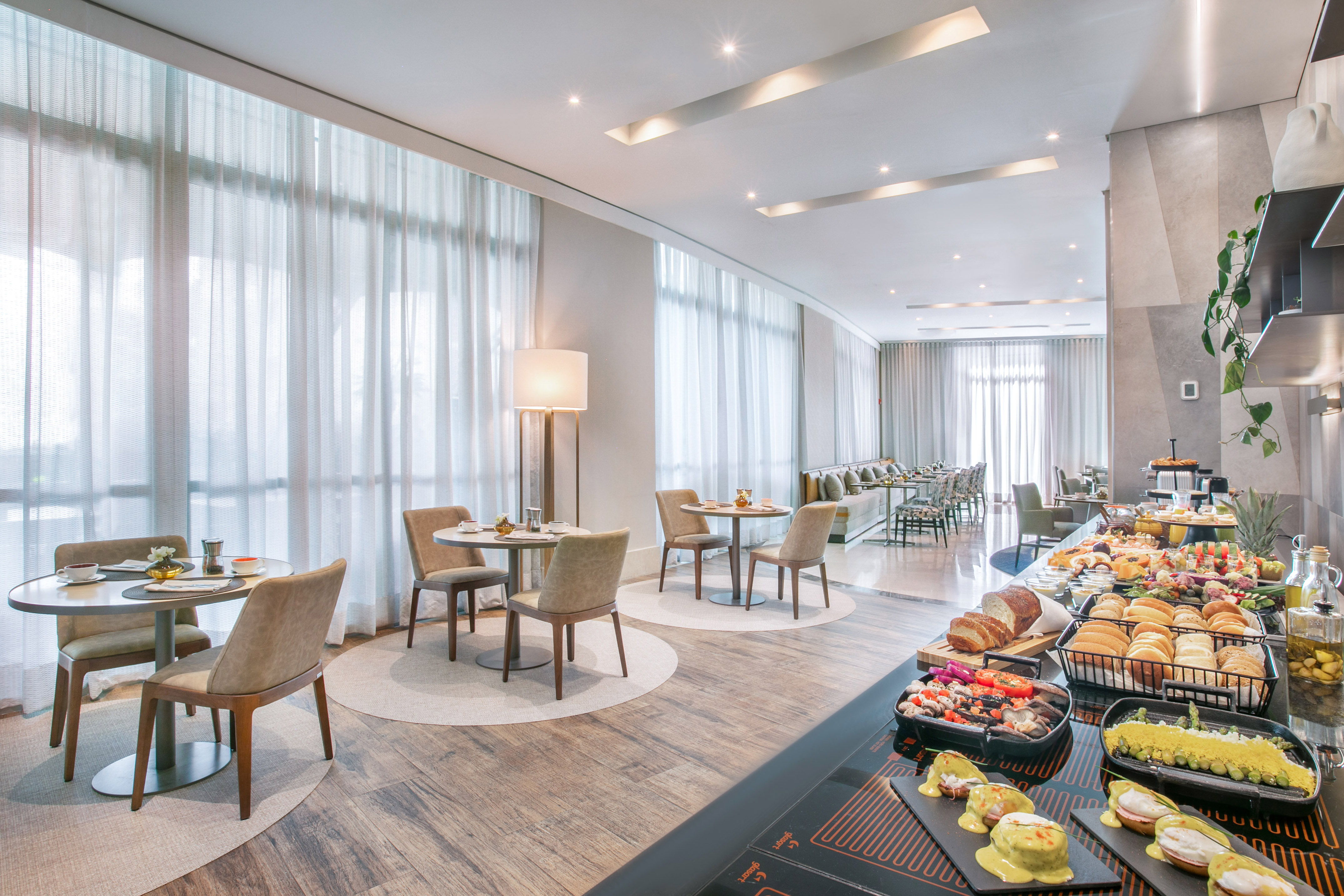 a room with a couch and chairs