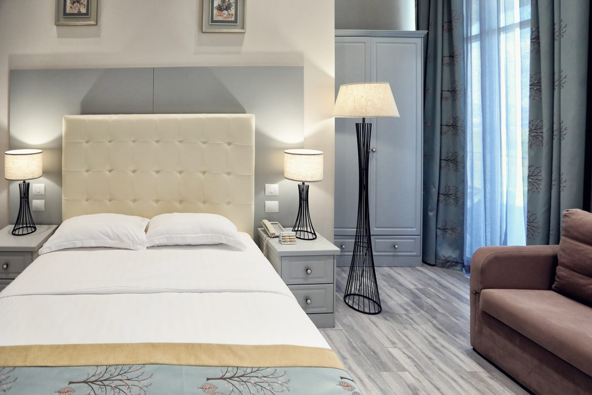 a bedroom with a bed and a lamp