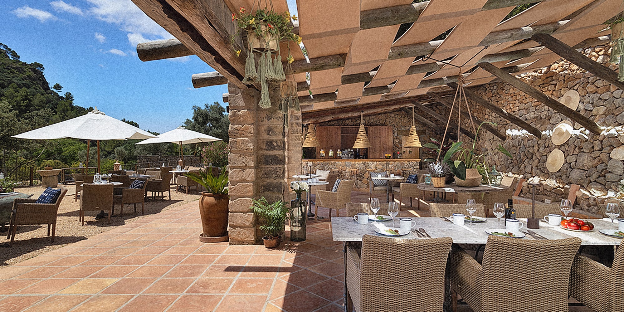 a patio with tables and chairs