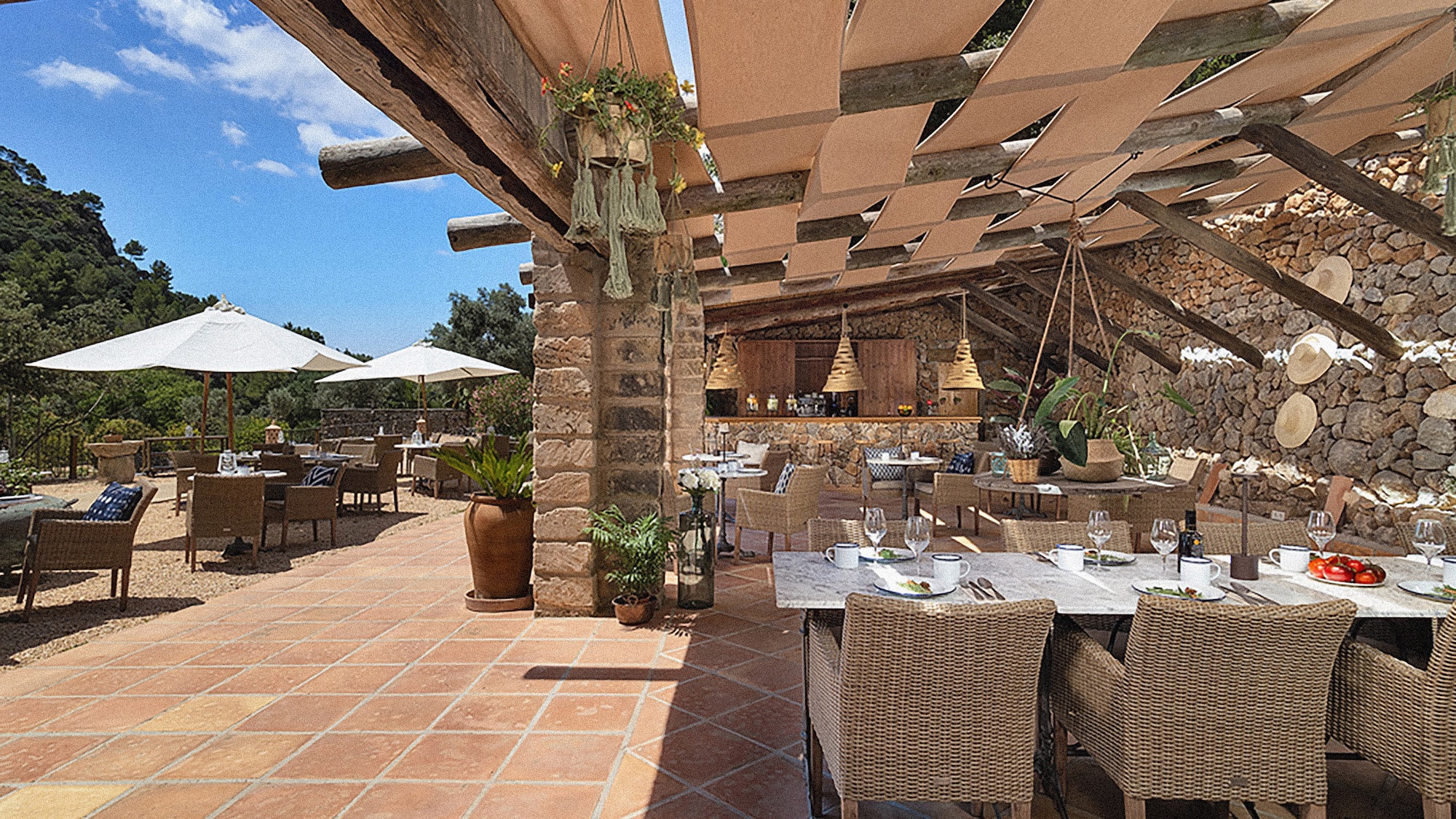 a patio with tables and chairs
