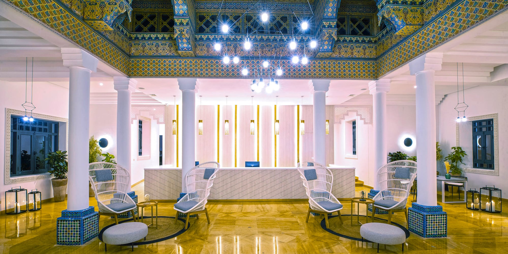 a lobby with chairs and a reception desk