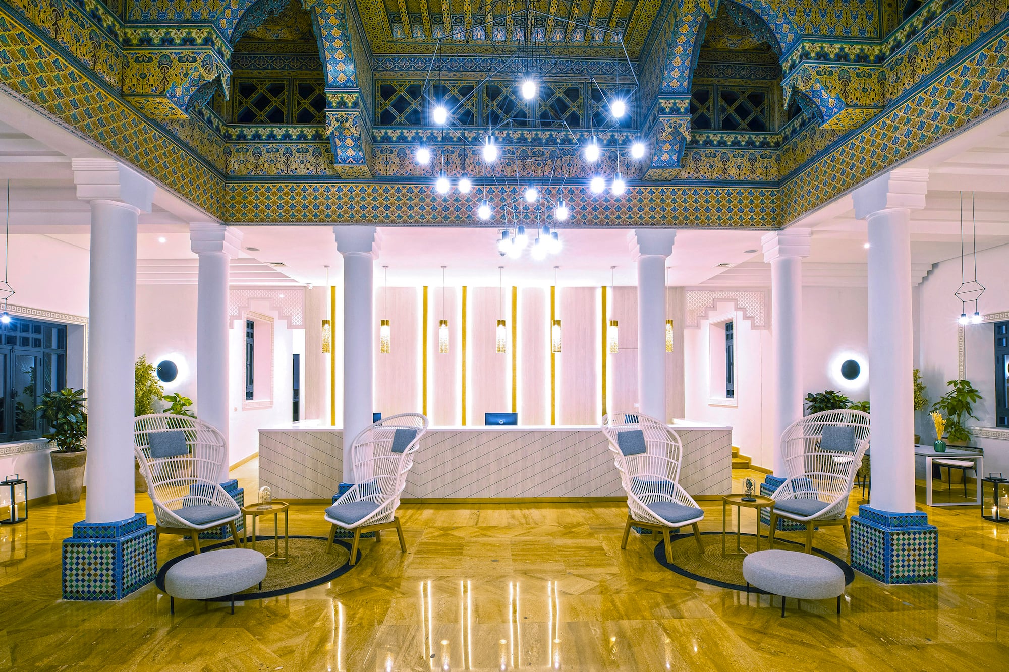 a lobby with chairs and a reception desk