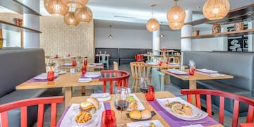 a restaurant with tables and chairs