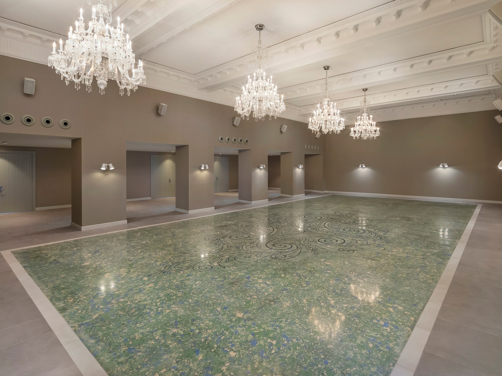 a large room with a marble floor and chandeliers