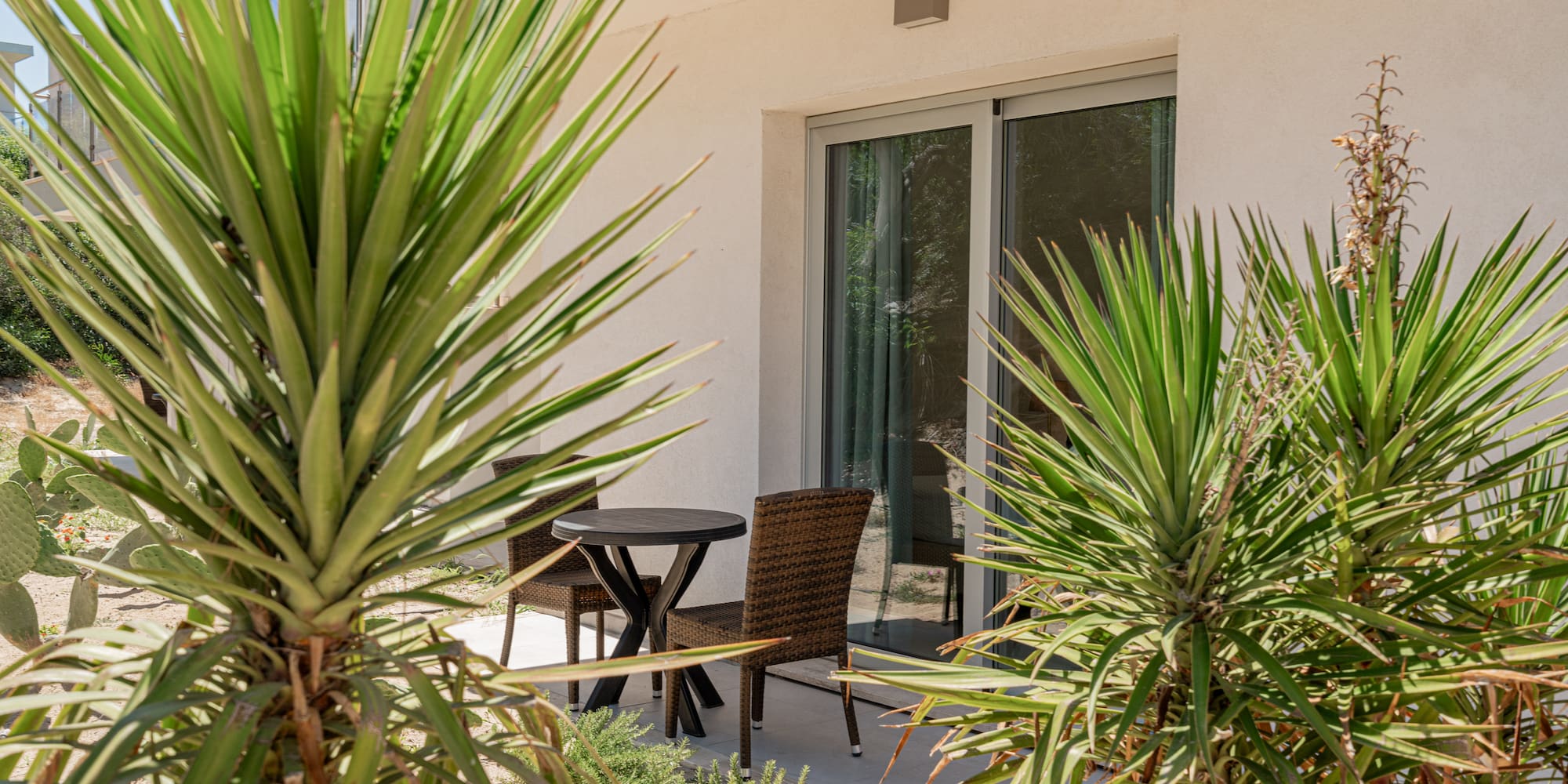 a table and chairs outside of a house