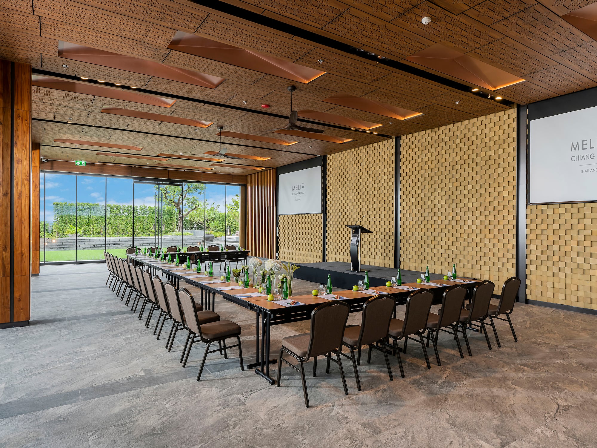 a room with a large table and chairs