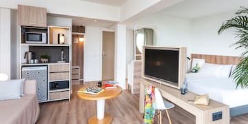 a room with a tv and a table
