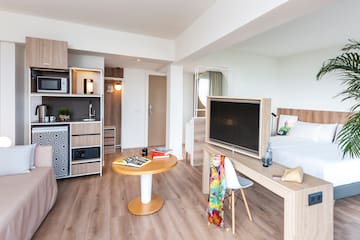 a room with a tv and a table
