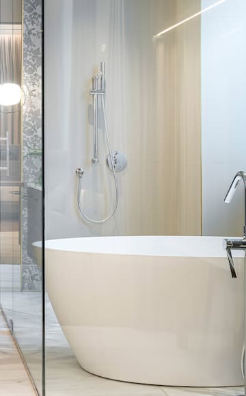 a bathtub and shower in a bathroom