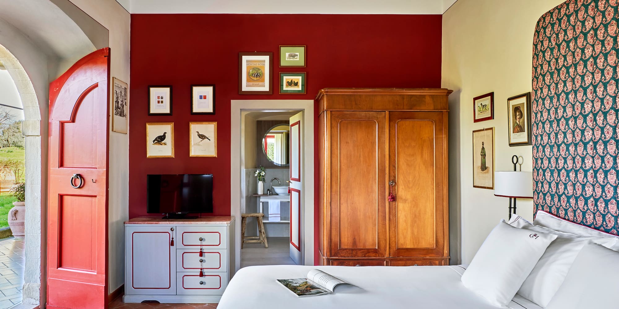 a bedroom with a bed and a cabinet