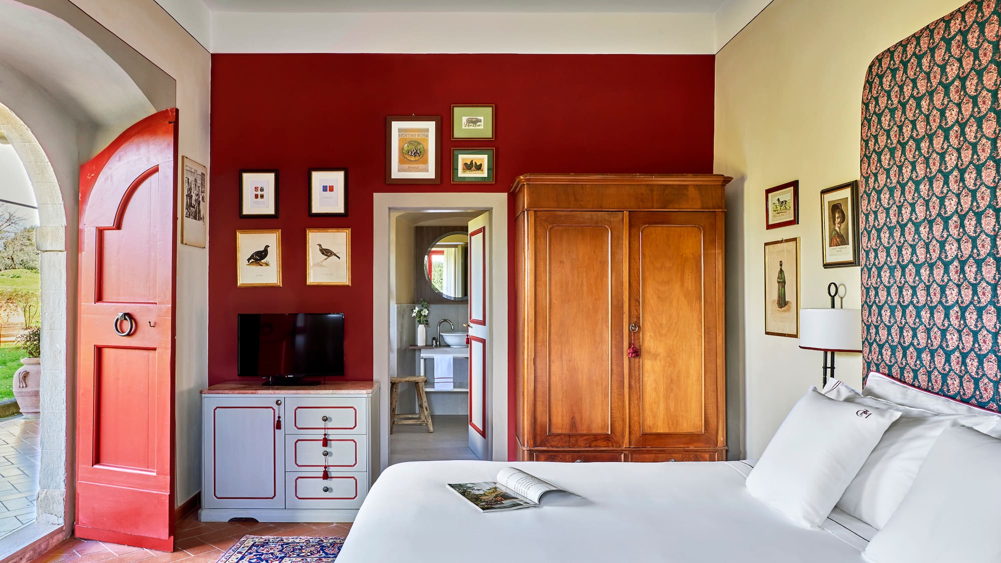 a bedroom with a bed and a cabinet