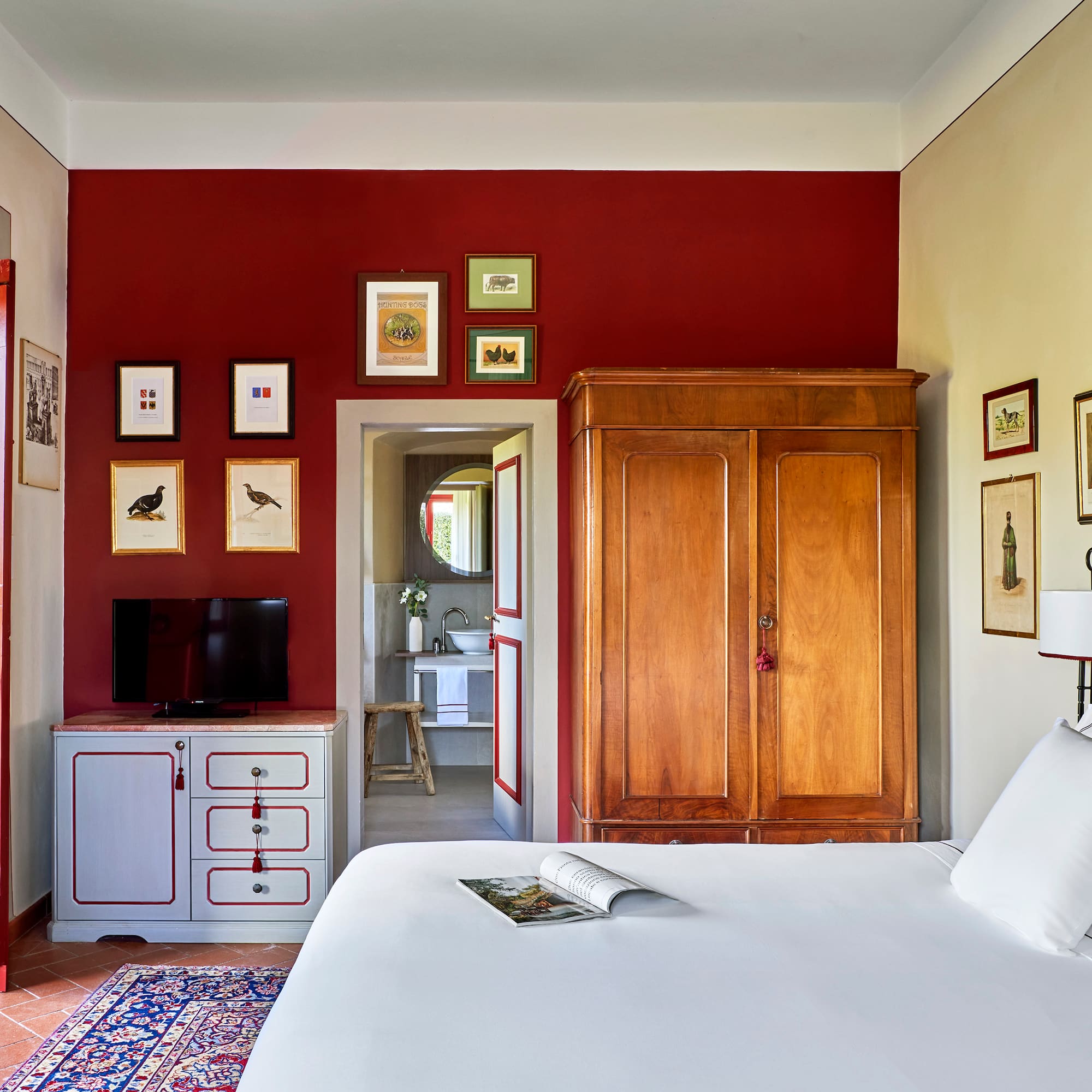 a bedroom with a bed and a cabinet