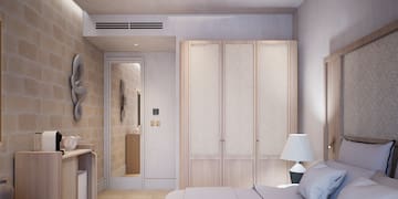 a bedroom with a bed and a closet