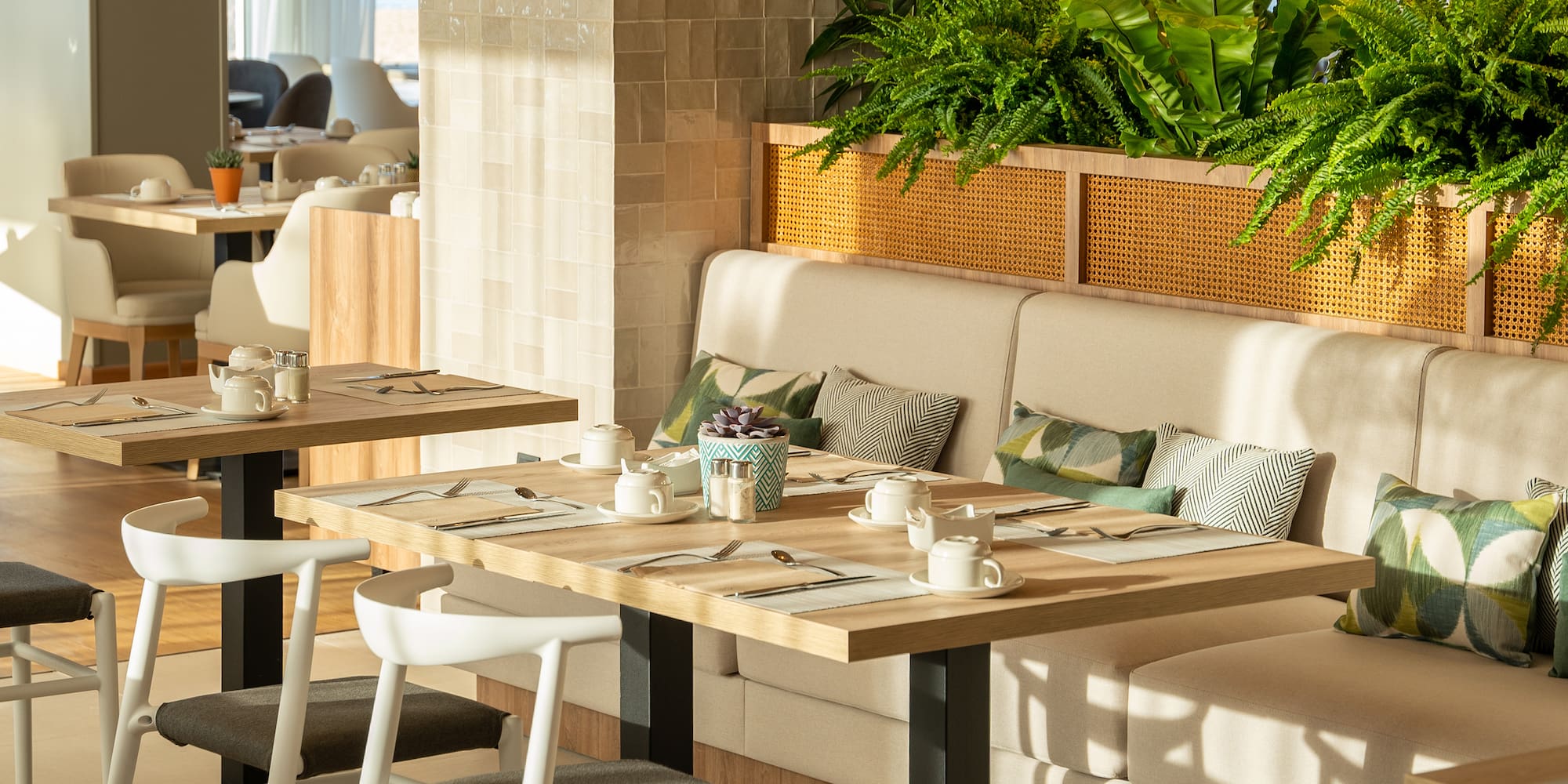 a table with plates and utensils in a restaurant