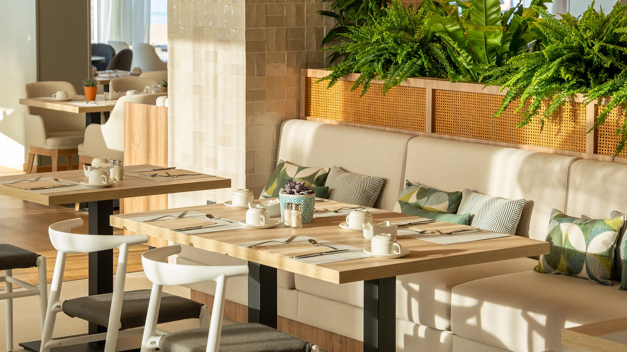 a table with plates and utensils in a restaurant