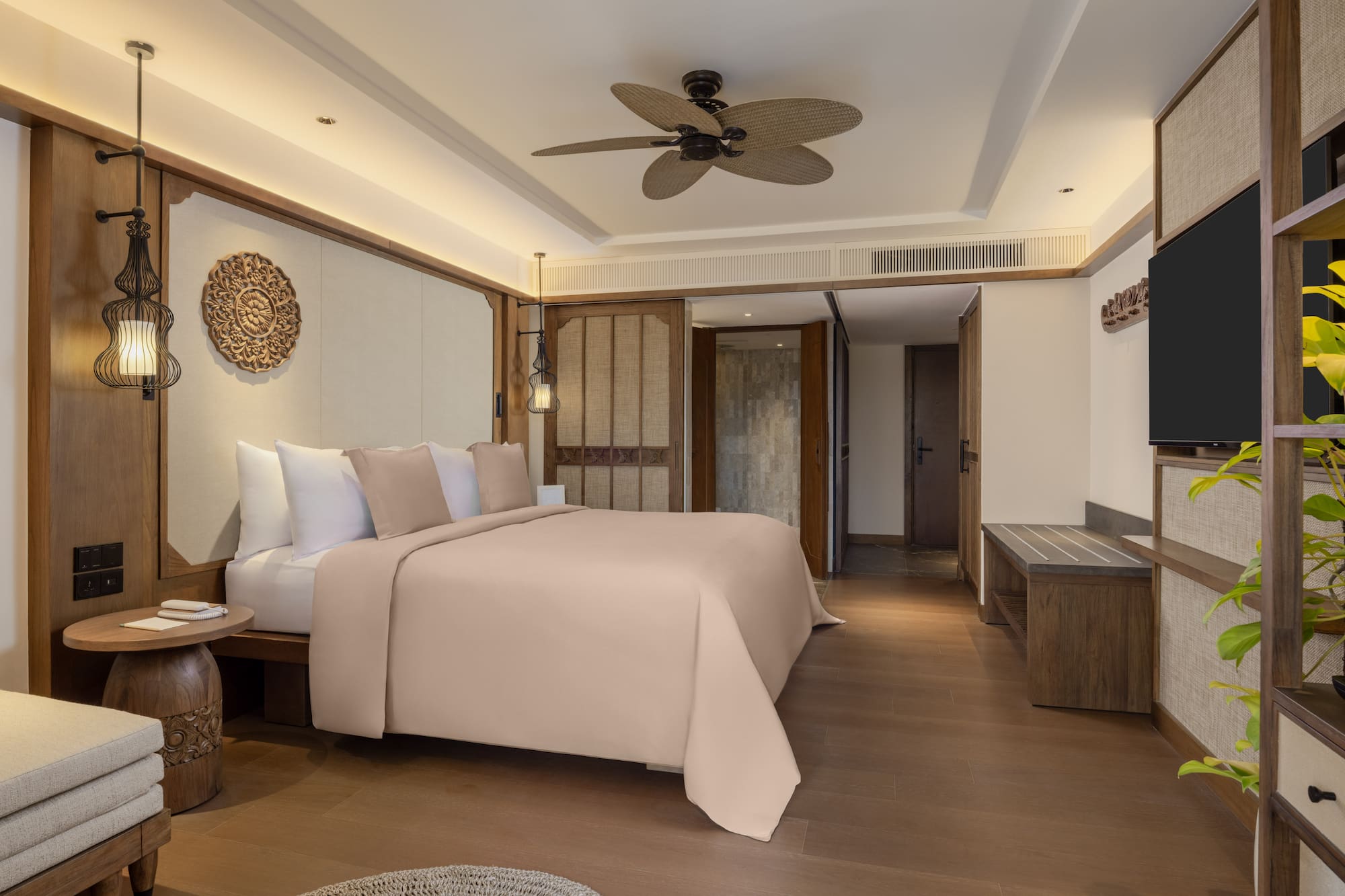 a room with a bed and a television