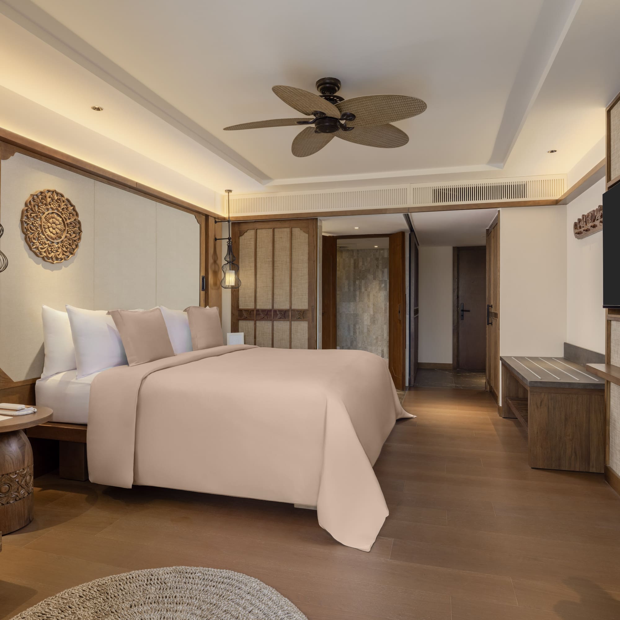 a room with a bed and a television