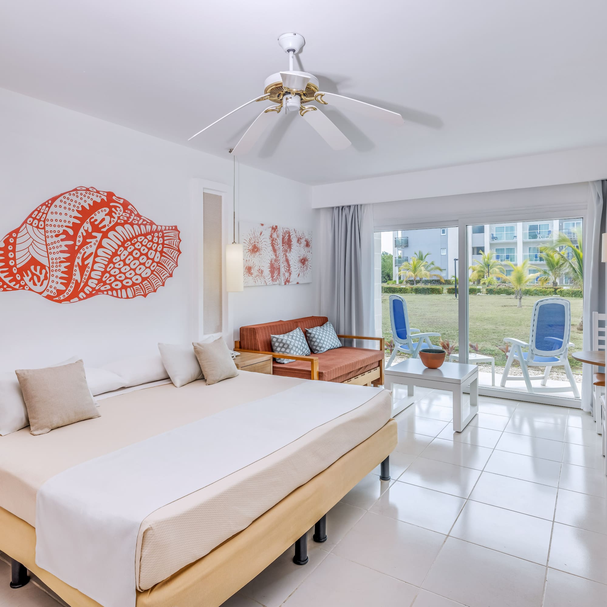 a room with a bed and a fan