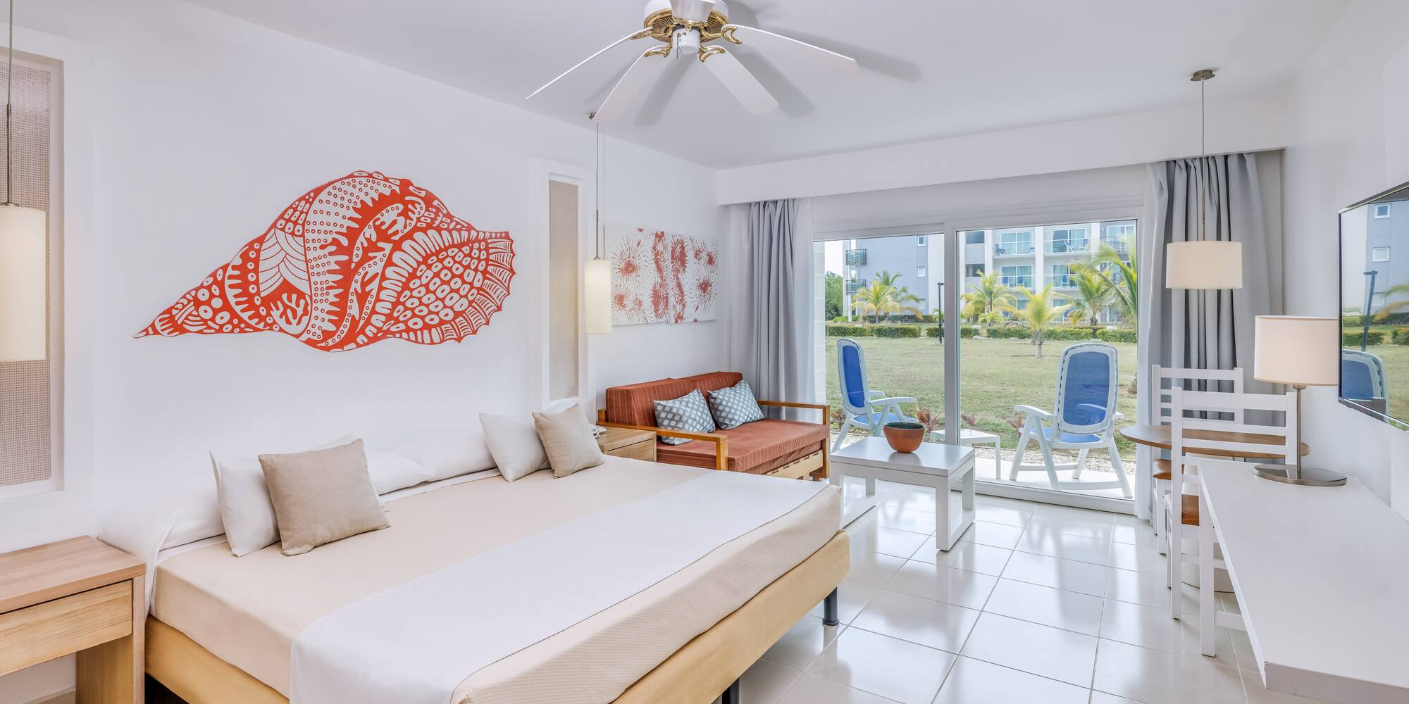 a room with a bed and a fan