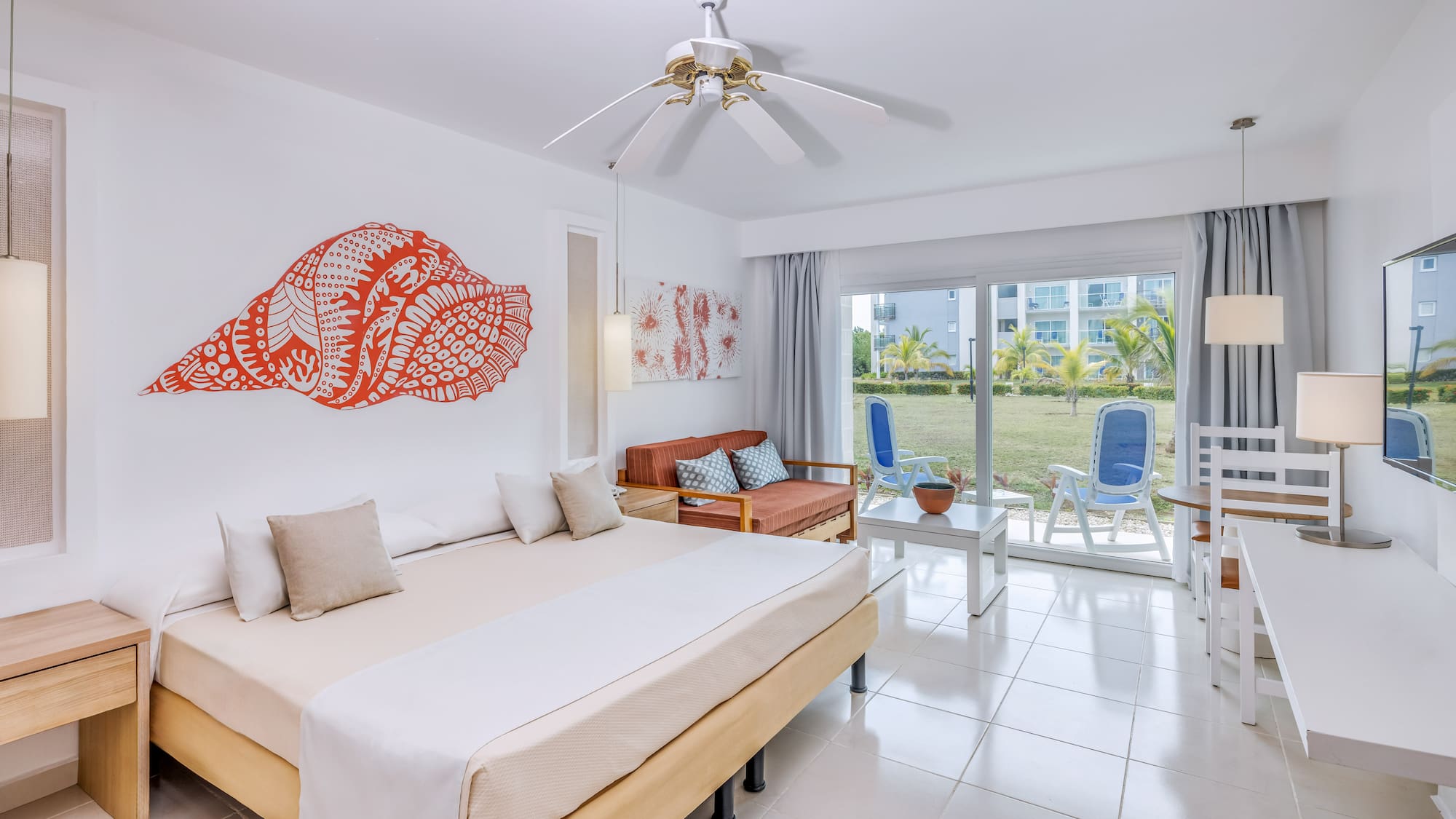 a room with a bed and a fan