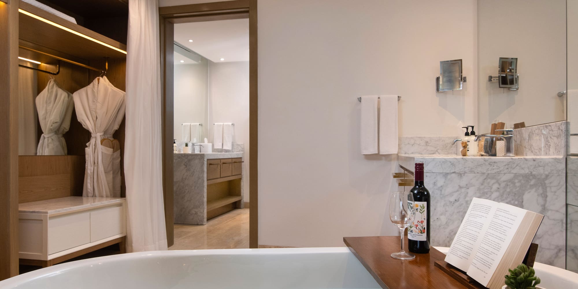 a bathroom with a bathtub and a book