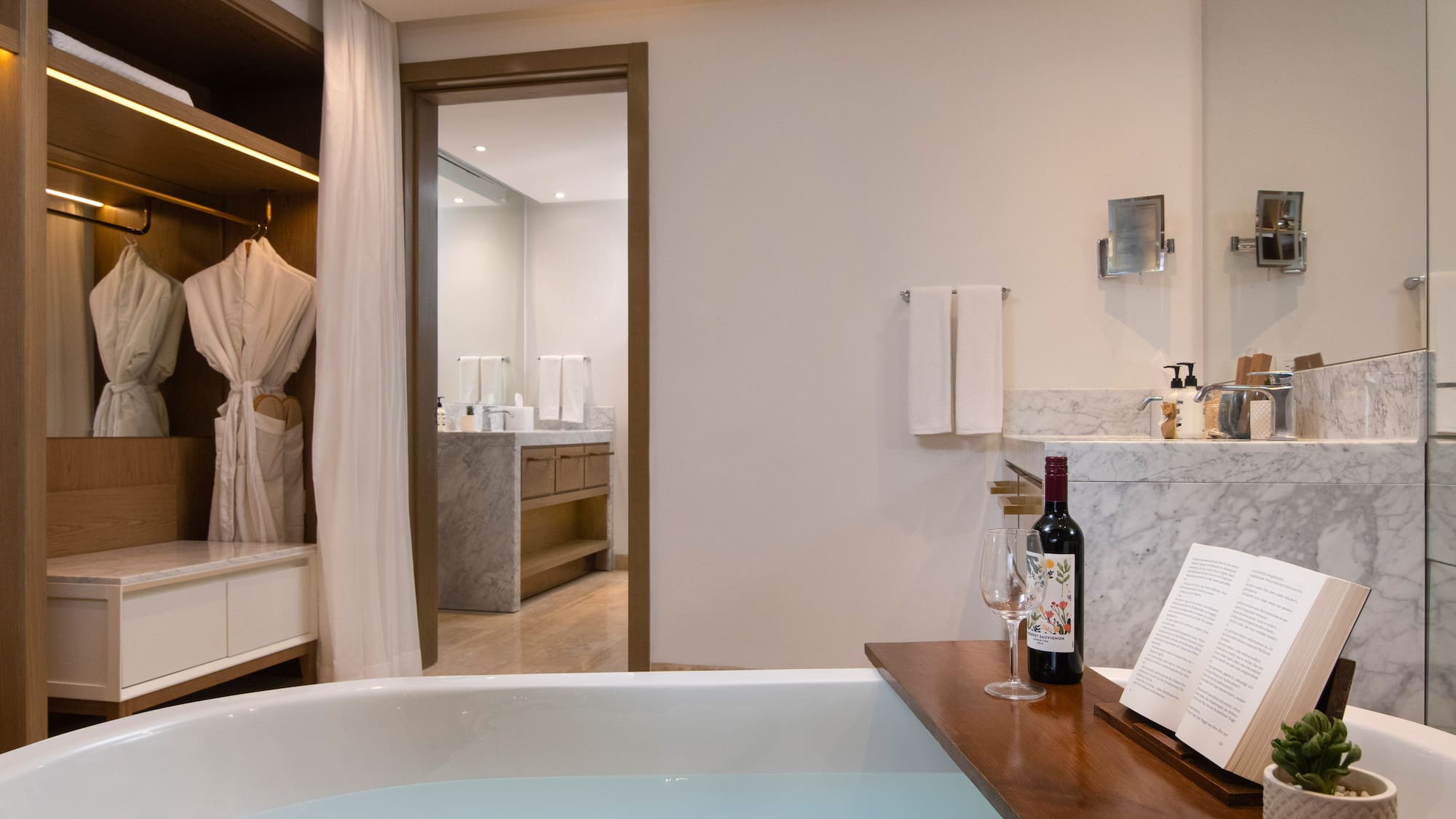 a bathroom with a bathtub and a book