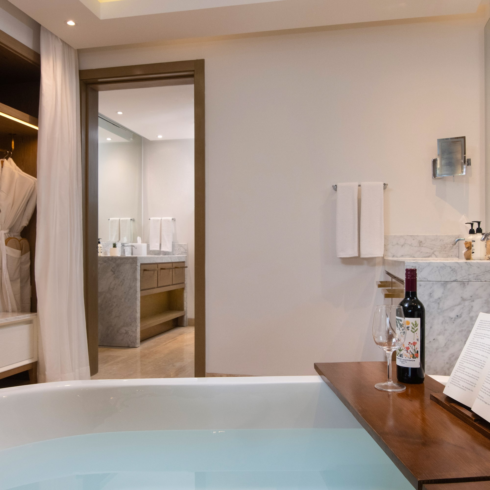 a bathroom with a bathtub and a book