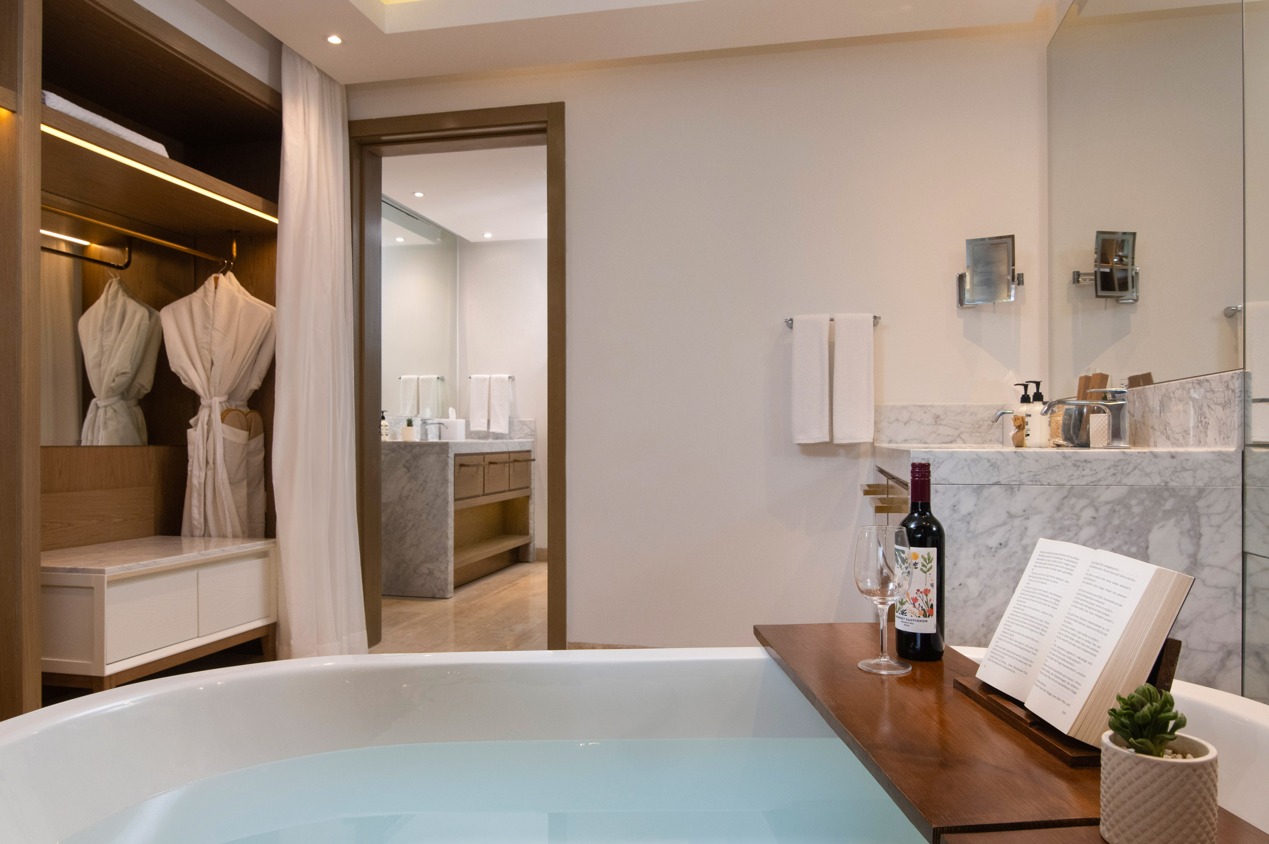 a bathroom with a bathtub and a book