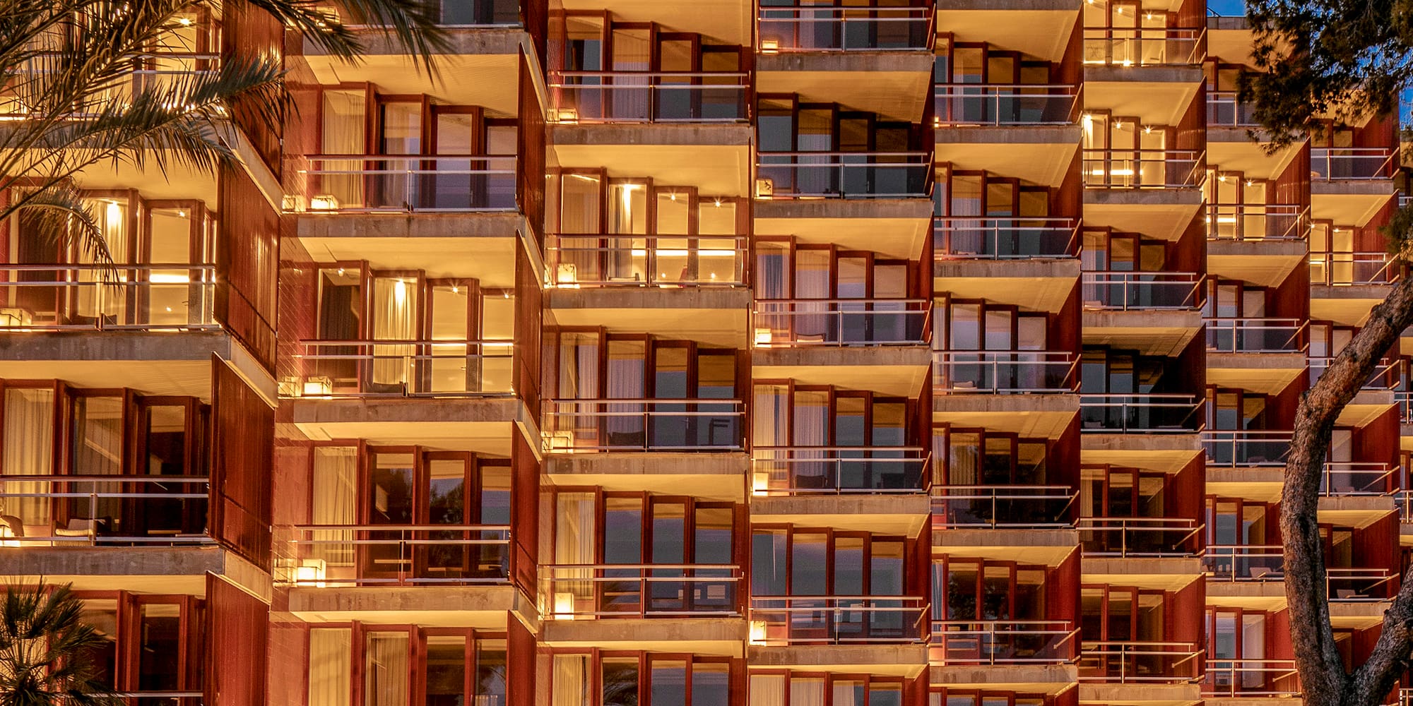 a building with many balconies and lights