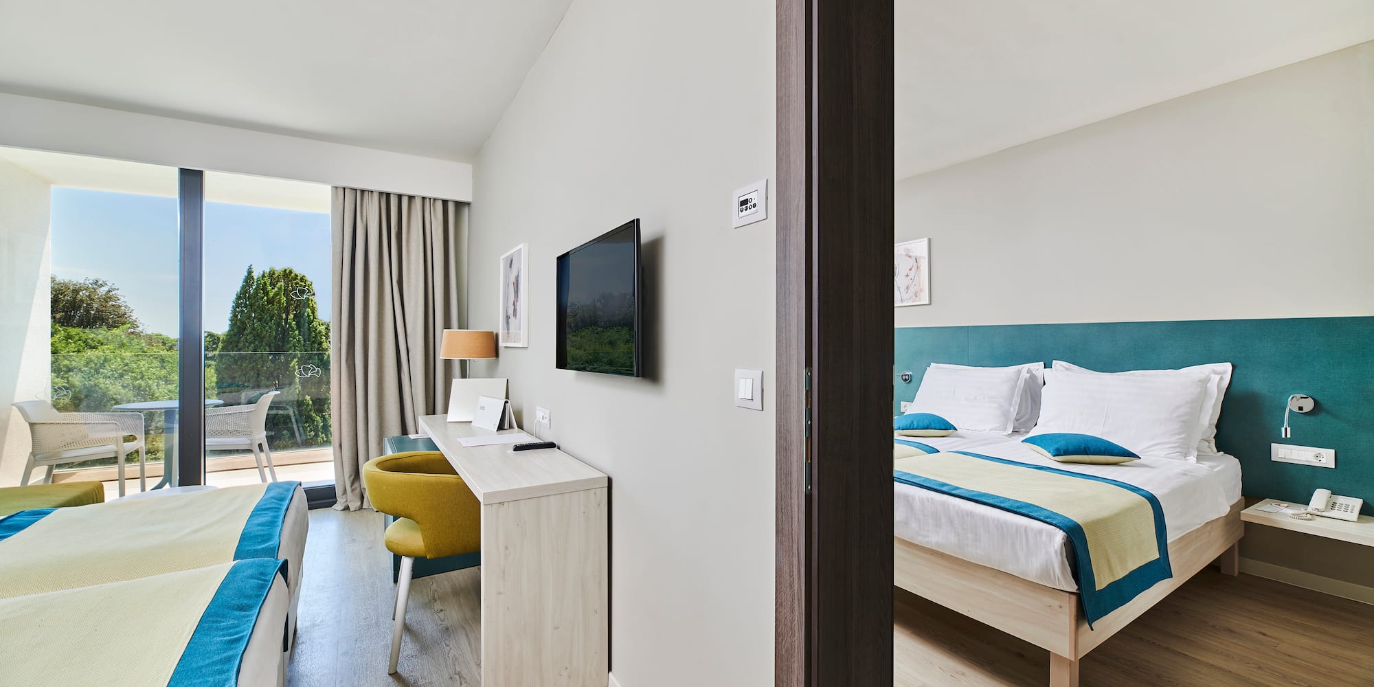 a room with a bed and a television