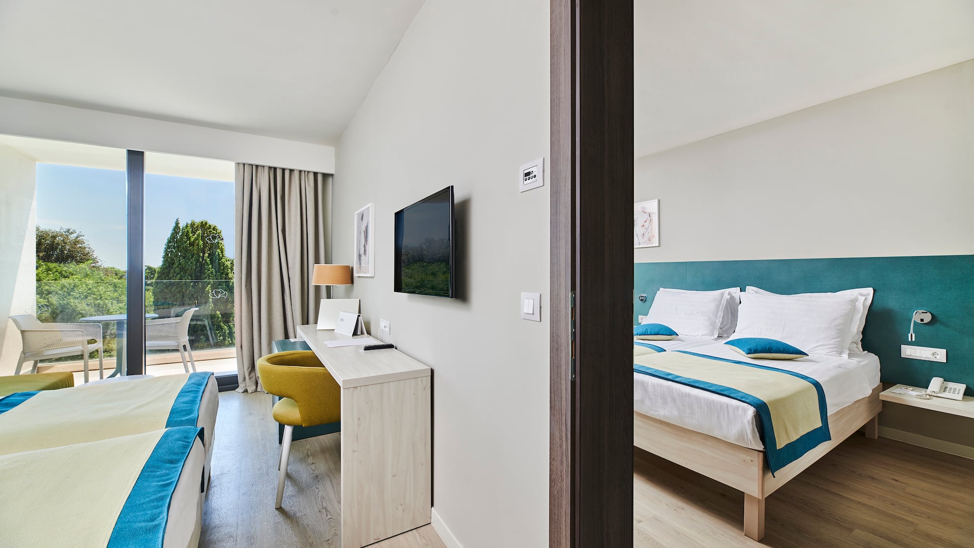 a room with a bed and a television