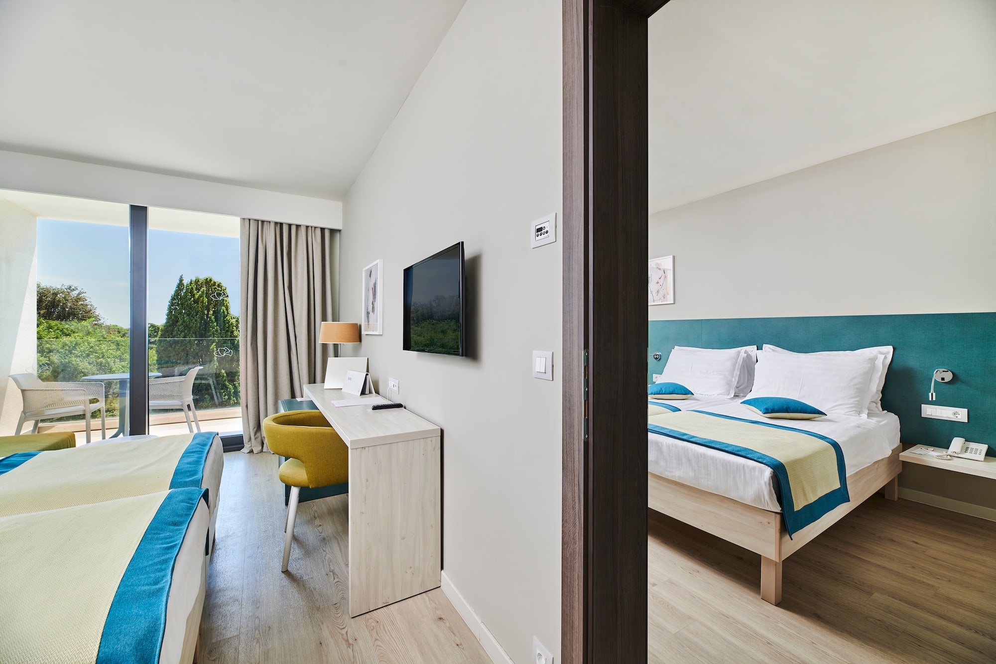 a room with a bed and a television