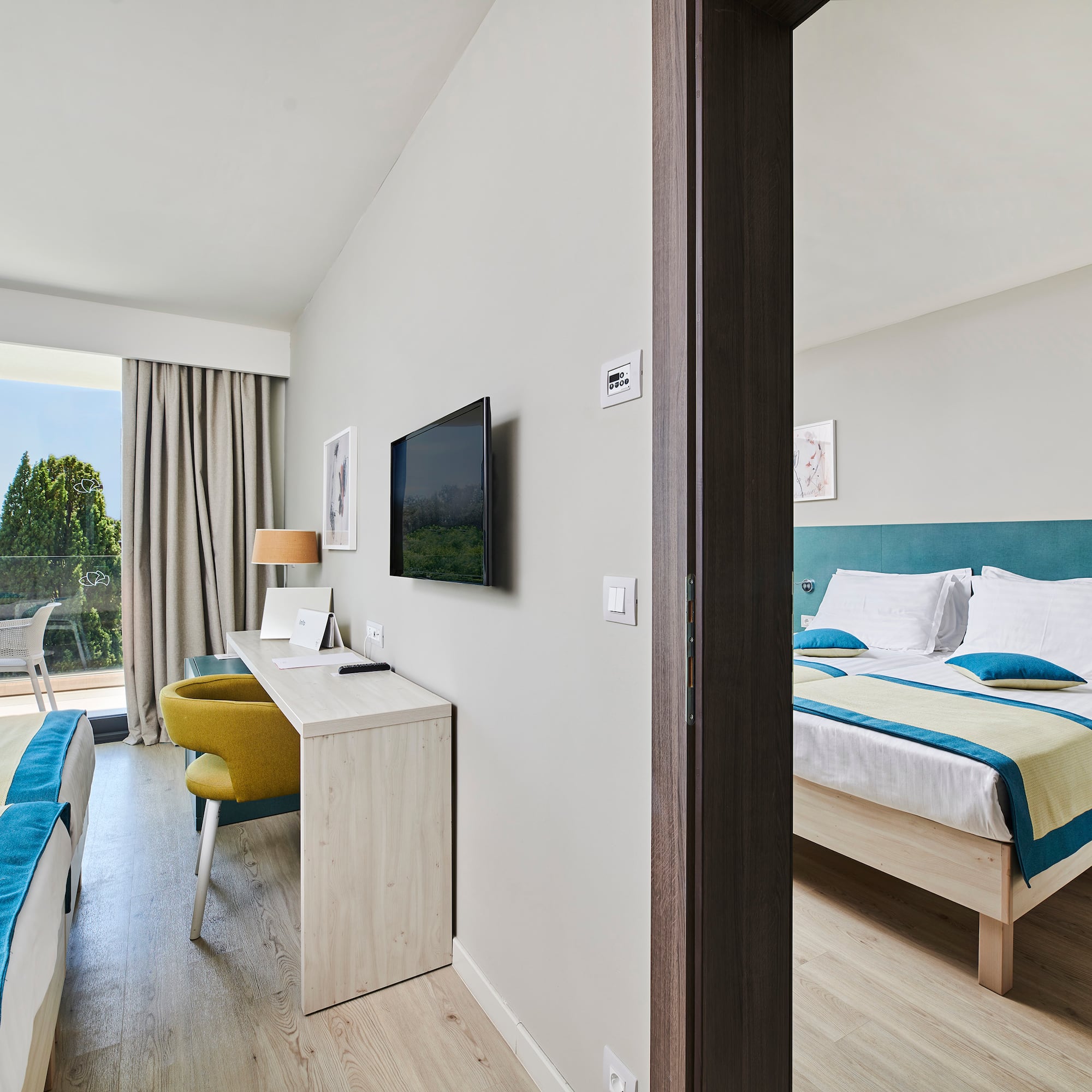 a room with a bed and a television