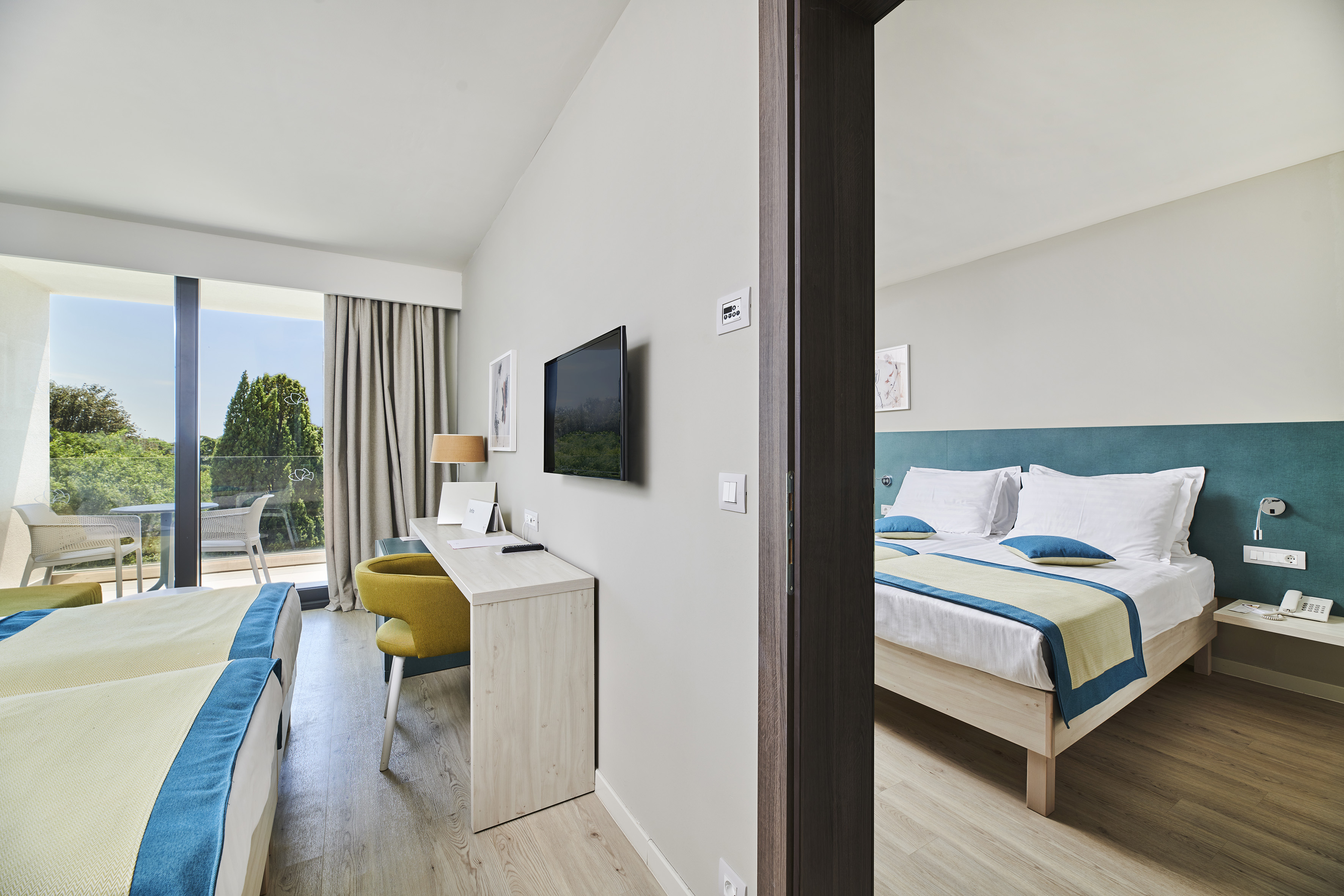 a room with a bed and a television