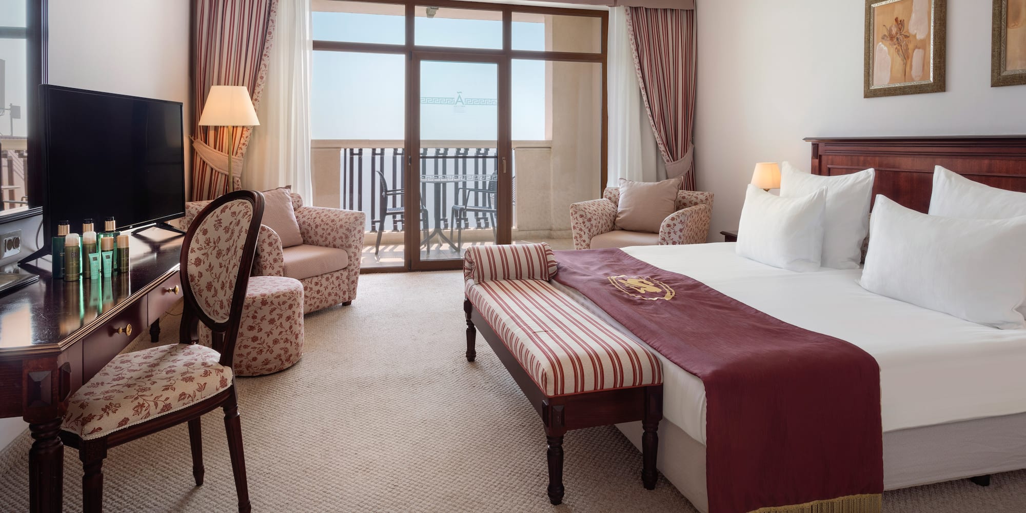 a room with a bed and a television