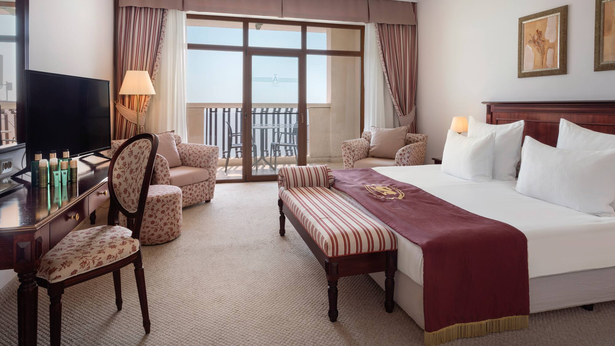 a room with a bed and a television