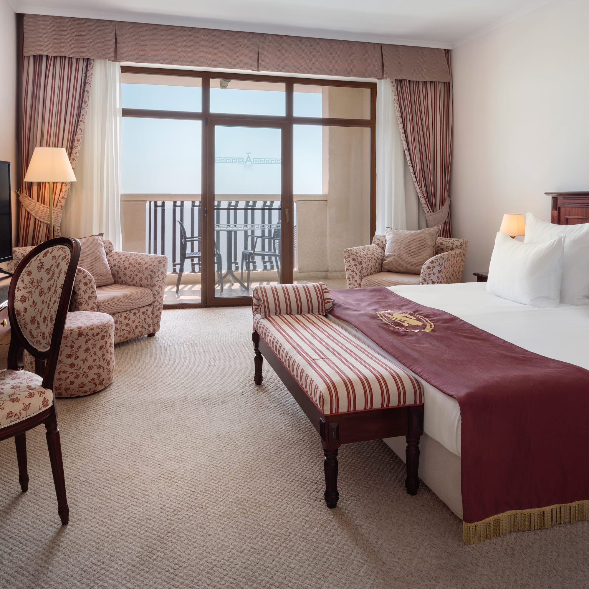 a room with a bed and a television