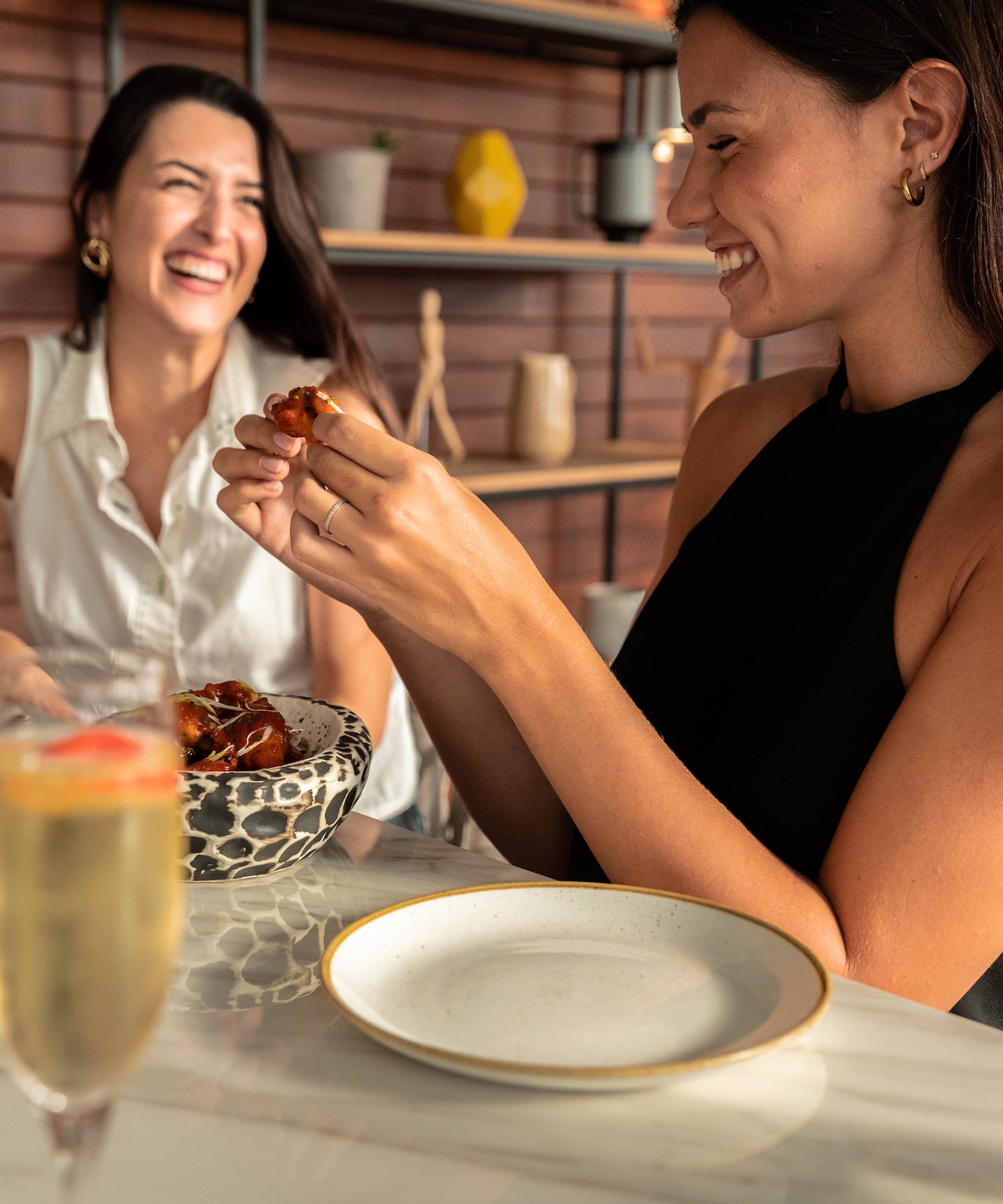 a group of women sitting at a table smiling