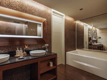 a bathroom with a sink and a bathtub.