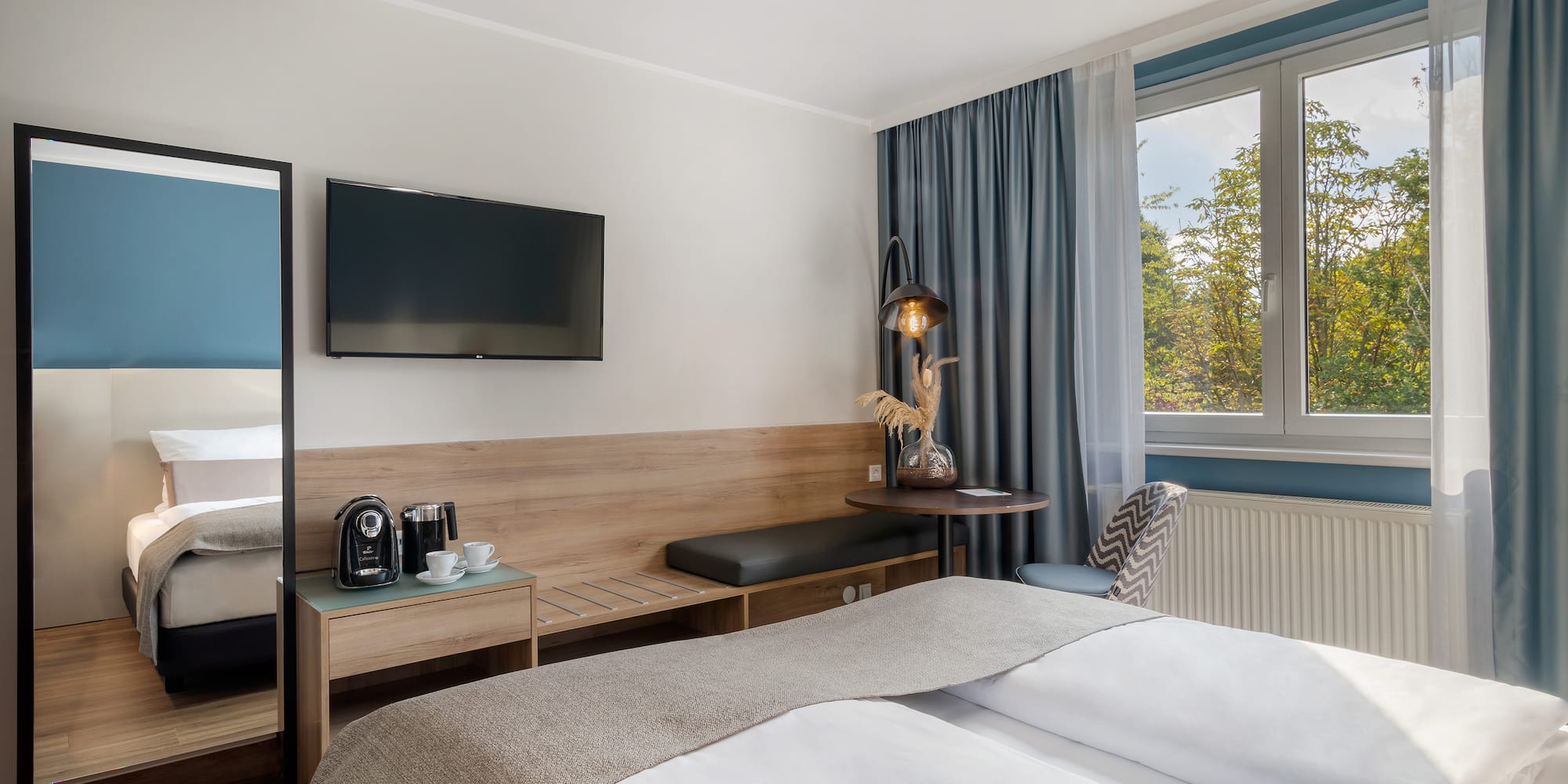 a room with a bed and a television