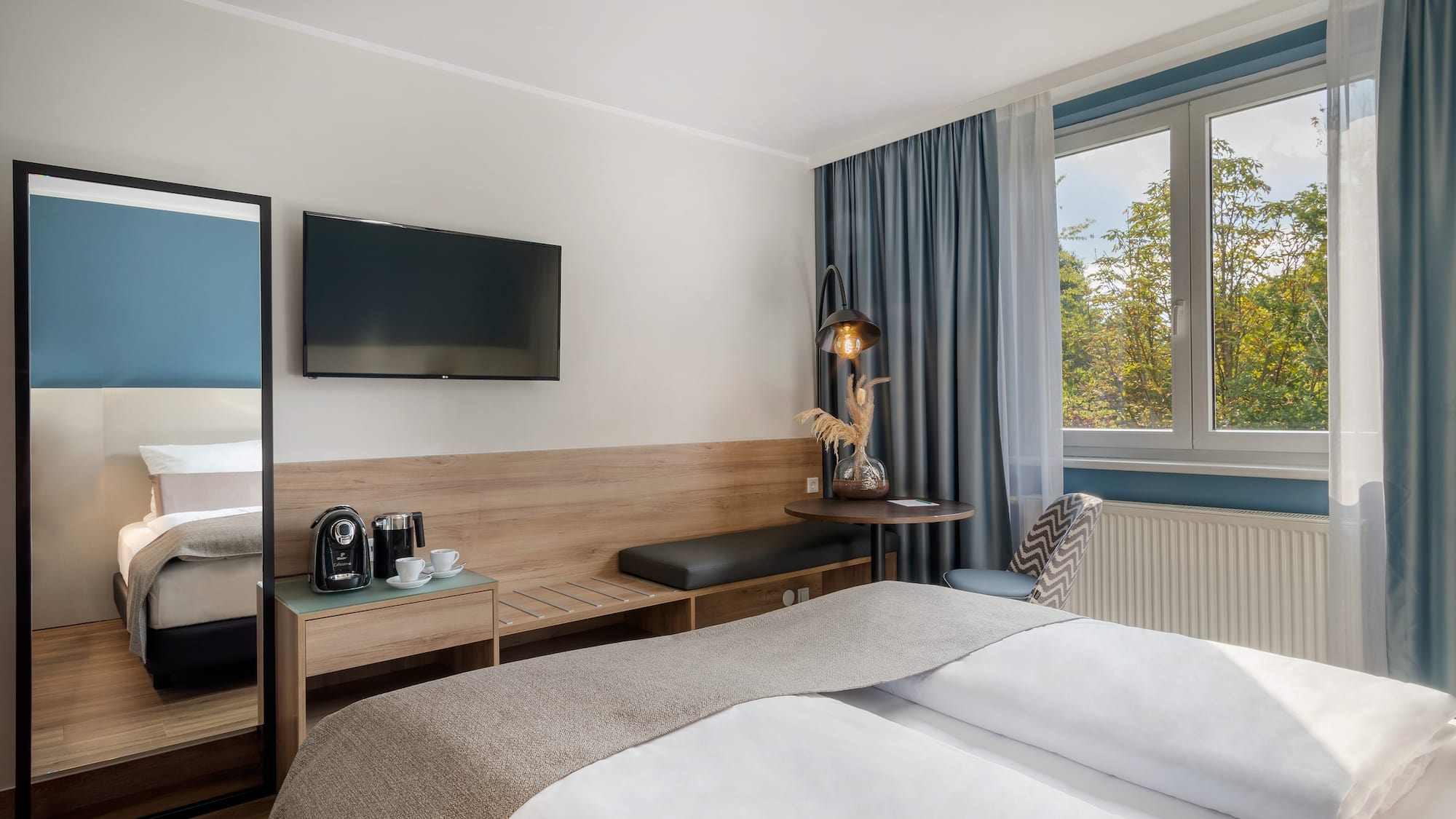 a room with a bed and a television