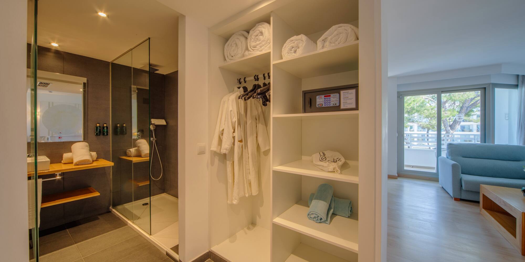 a bathroom with a shower and towels