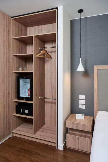 a room with a closet and a bed