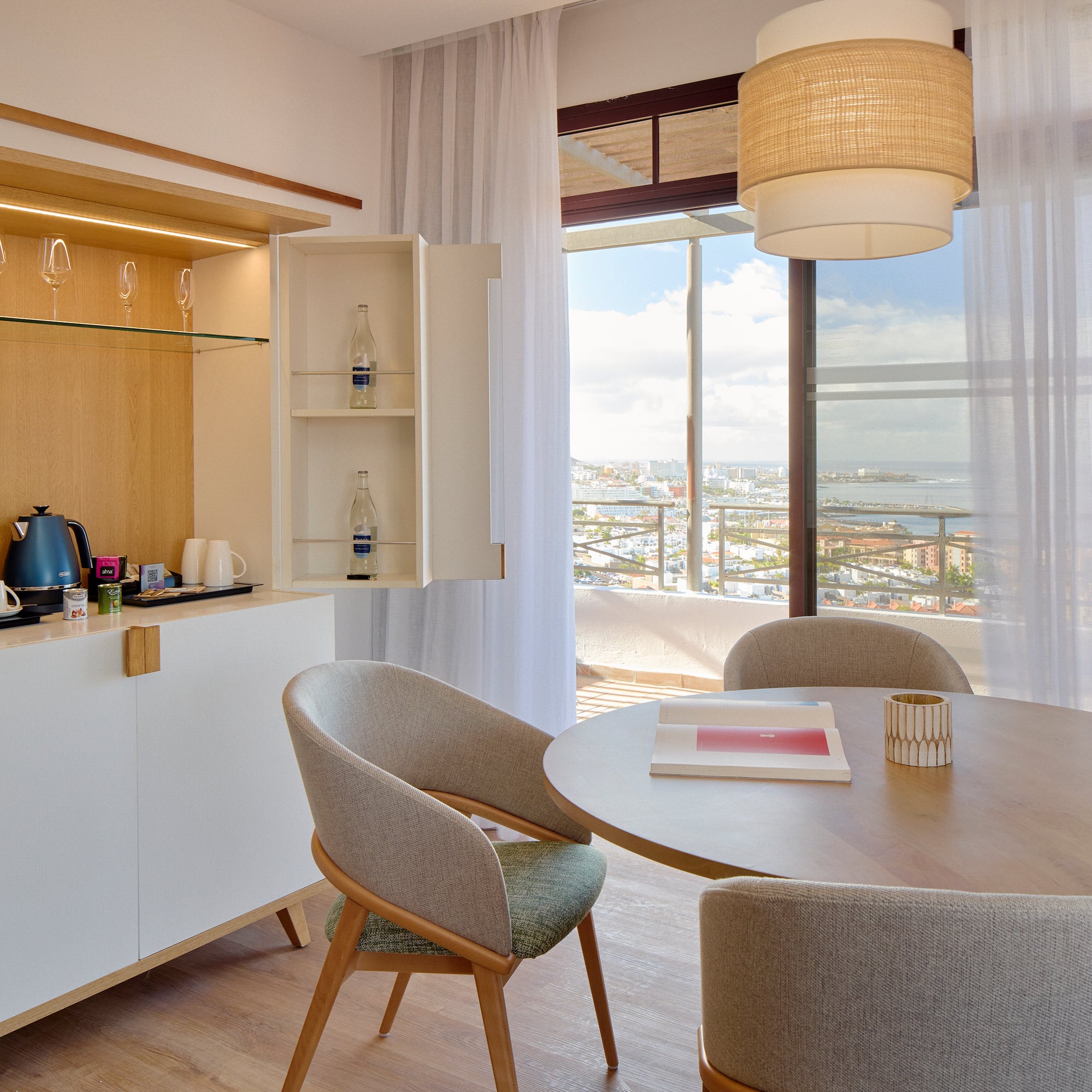 a dining room with a table and chairs