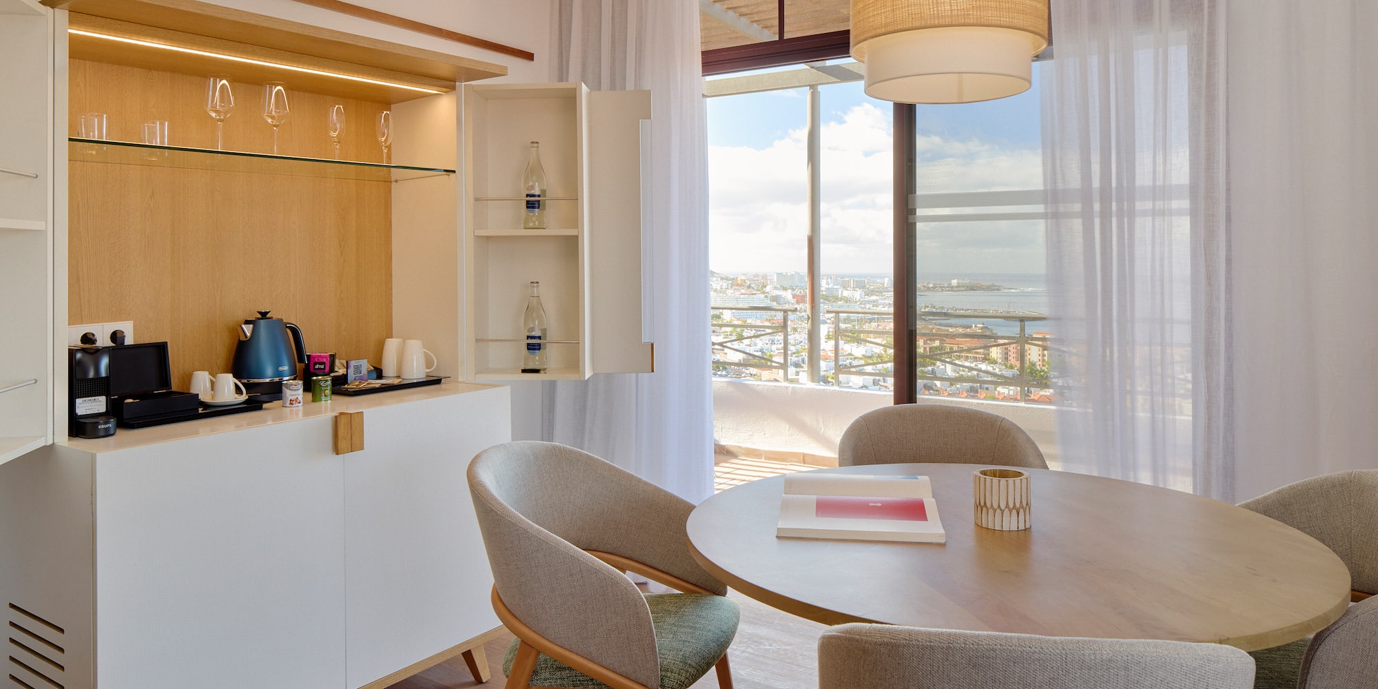 a dining room with a table and chairs