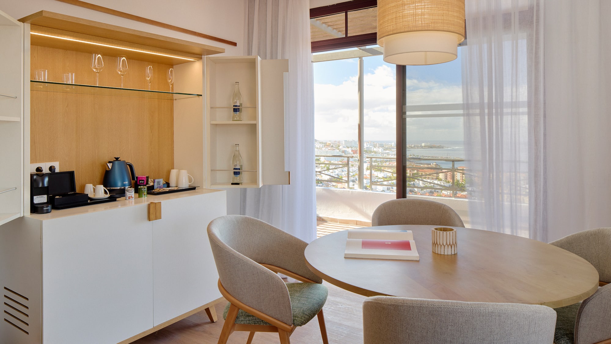 a dining room with a table and chairs
