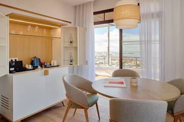 a dining room with a table and chairs