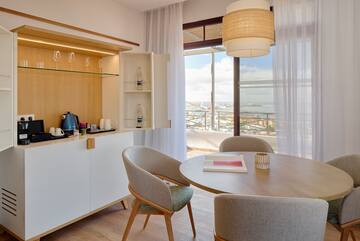 a dining room with a table and chairs