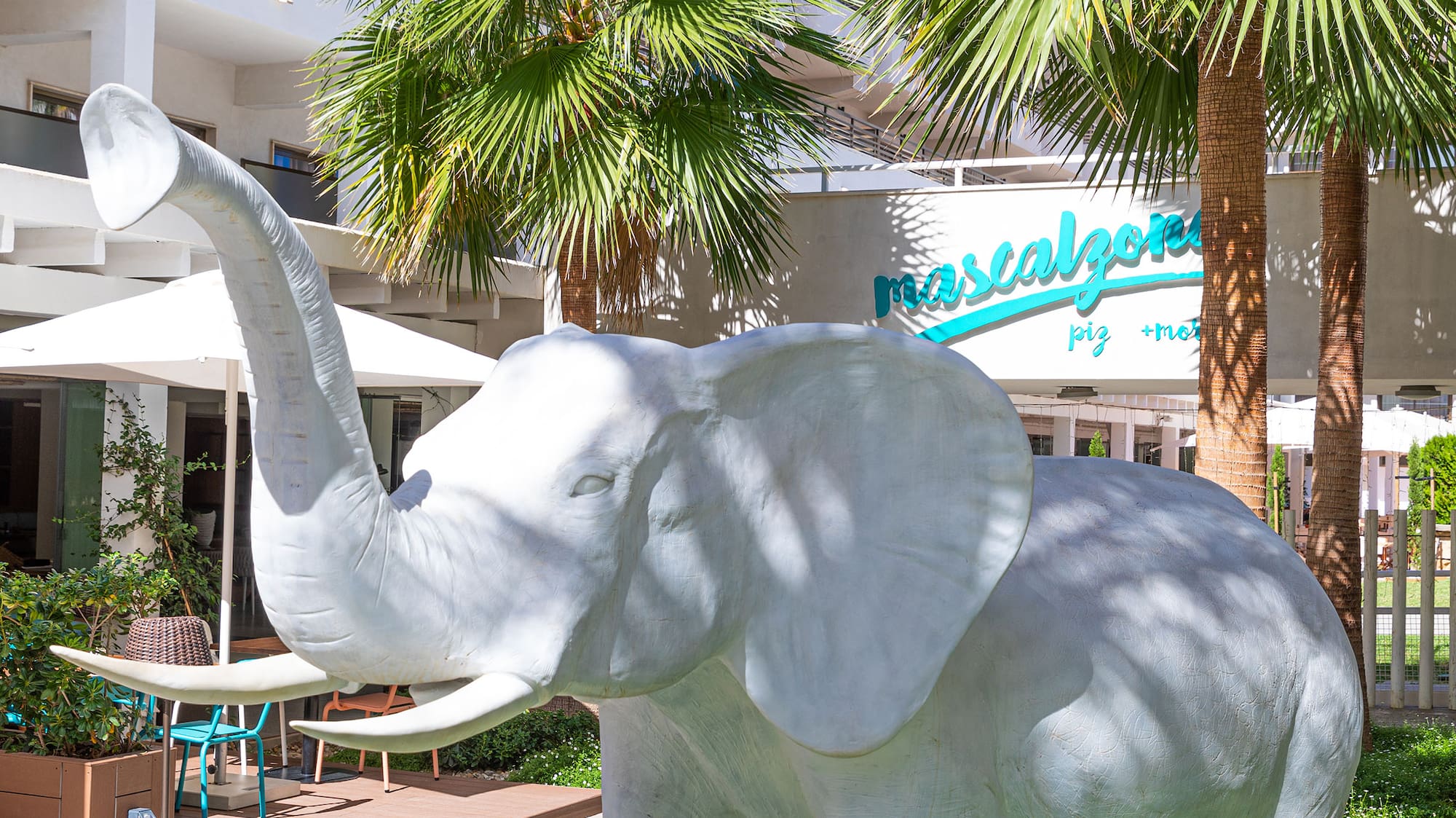 a statue of an elephant in a courtyard